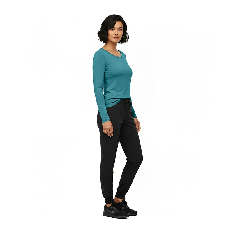 Wholesale women's teal long-sleeve crew neck top paired with black jogger pants and black sneakers