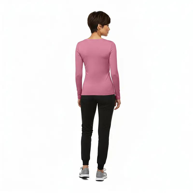 Wholesale women's pink long-sleeve fitted top with black jogger pants and gray sneakers
