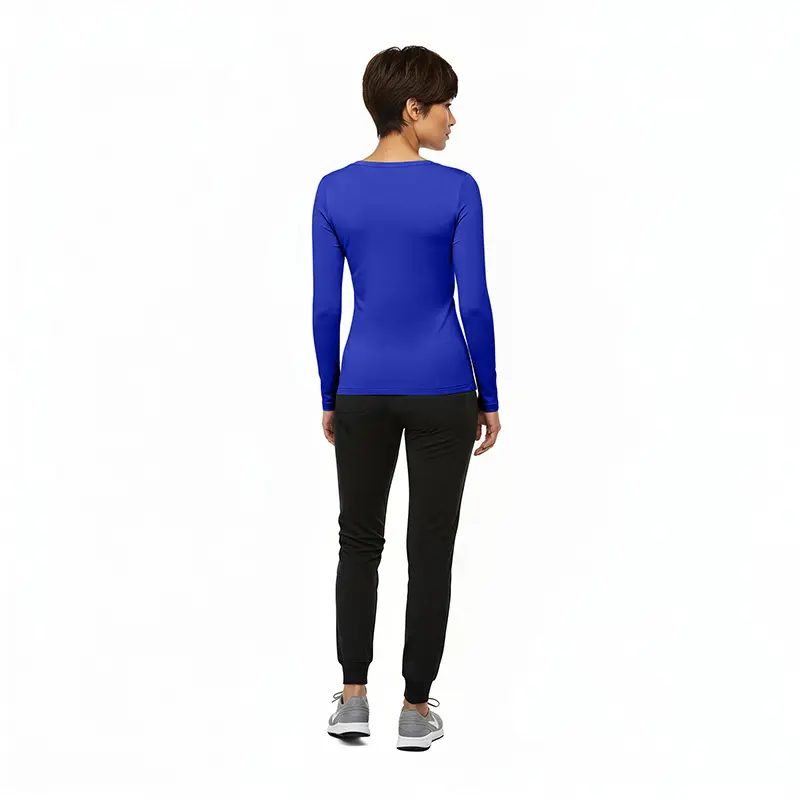 Wholesale women's blue long-sleeve top with black jogger pants and gray sneakers