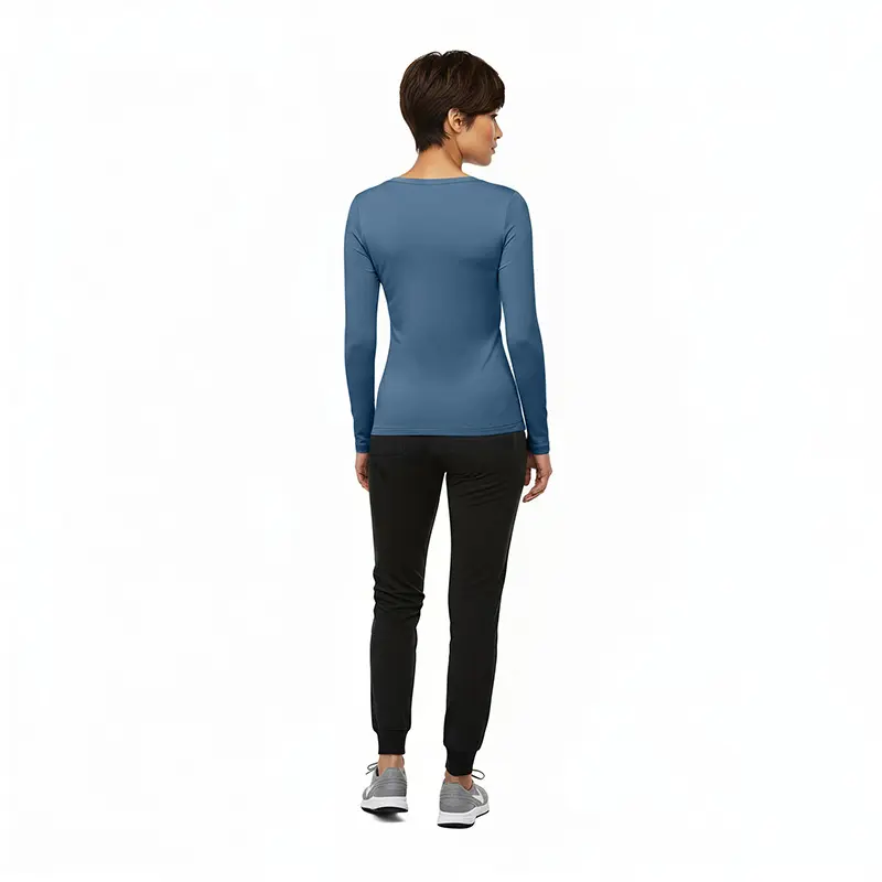 Wholesale women's blue long-sleeve fitted top with black jogger pants and gray sneakers