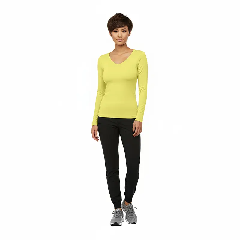 Wholesale women's yellow long-sleeve v-neck top with black joggers and gray sneakers