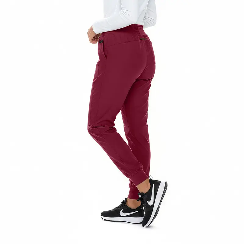 Wholesale women's burgundy jogger pants with elastic waistband and cuffed ankles