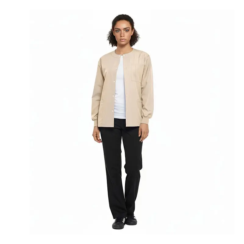 Wholesale women's beige button-up cardigan layered over white tee with black pants and black sneakers