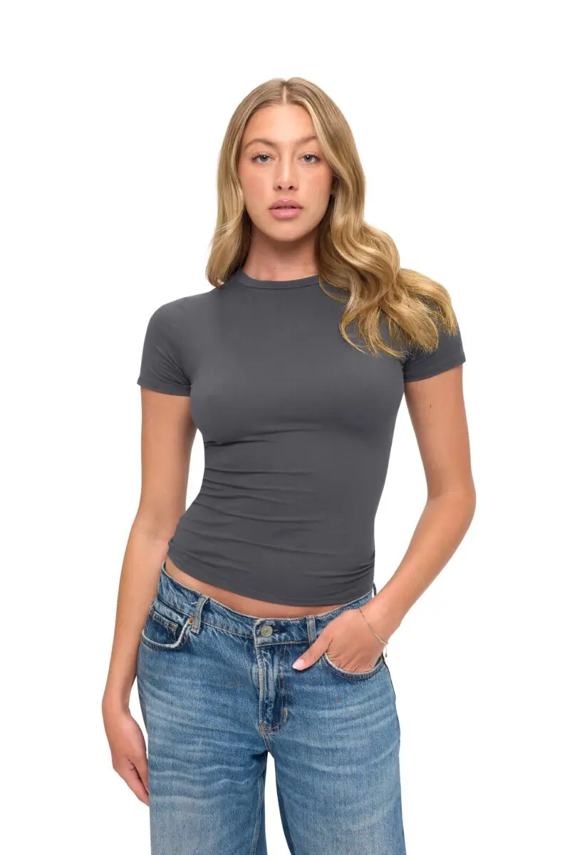 Wholesale women's charcoal short-sleeve fitted crew neck t-shirt paired with blue denim jeans