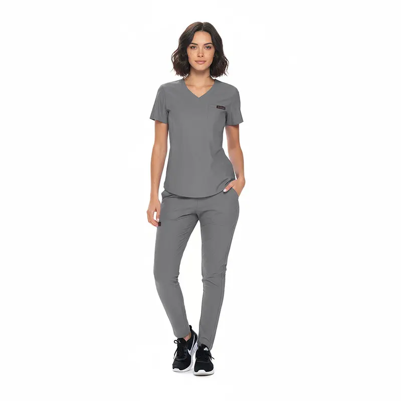 Wholesale women's gray v-neck scrub top and pants set with short sleeves and front pocket detail