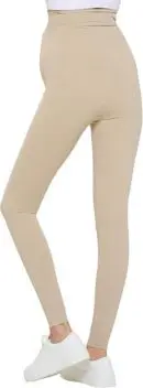 Wholesale beige high-waisted leggings with mesh knee panels worn with white sneakers