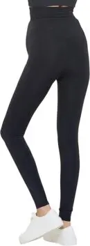 Wholesale black high-waisted leggings with ankle cuffs paired with white sneakers